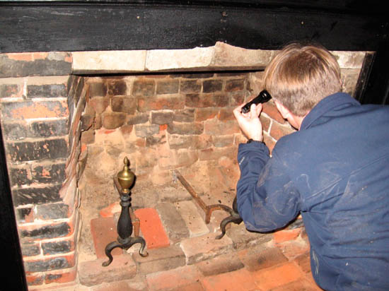 Archeological examination of historic fireplace